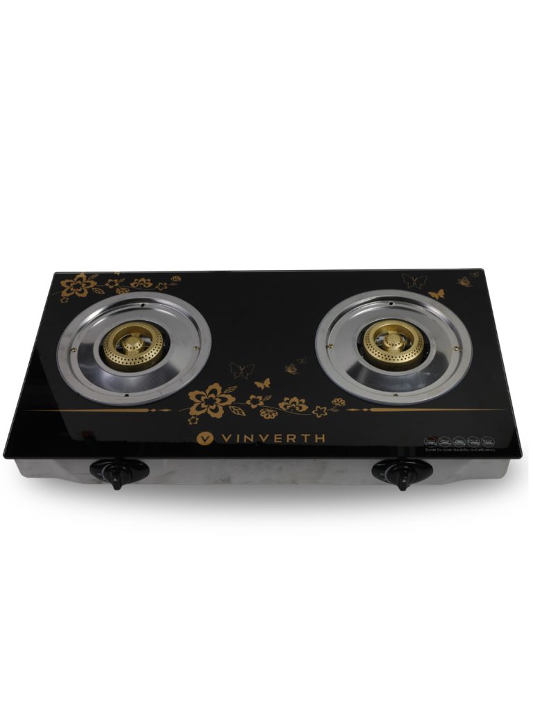 VINVERTH E210005 is a 2-burner tempered glass gas stove (755 × 437 × 112 mm) with a stainless-steel body, cast-iron burners, and Japan ignition technology. It claims up to 60% gas saving and is designed with a focus on safety and practicality. The look features a shiny black glass top with gold floral and butterfly artwork, silver burners with brass centers, black side knobs, and a light grey base